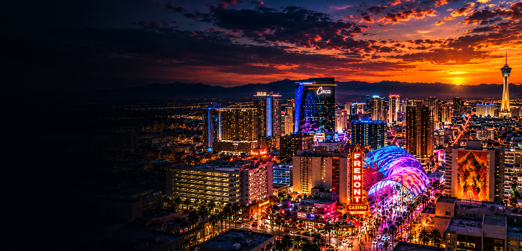The Las Vegas neon skyline glowing under a fiery sunset